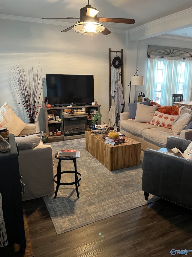 living room with crown molding, ceiling fan, and dark hardwood / wood-style flooring