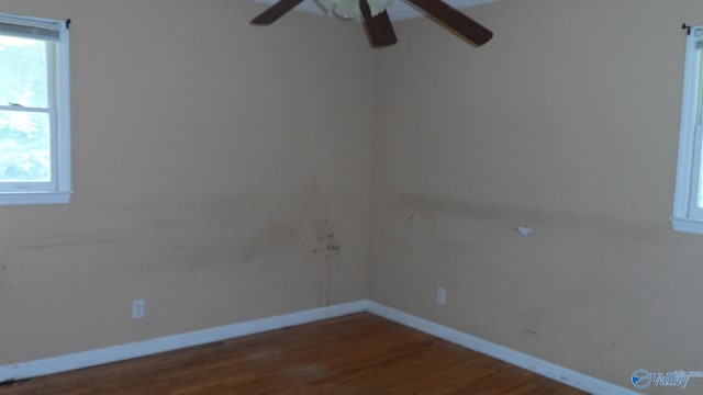 empty room featuring hardwood / wood-style flooring and ceiling fan