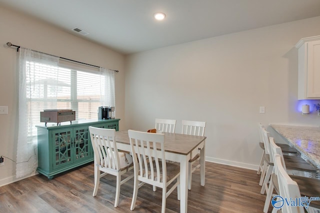 dining area featuring wood-type flooring