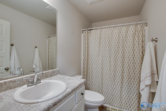 bathroom with vanity and toilet