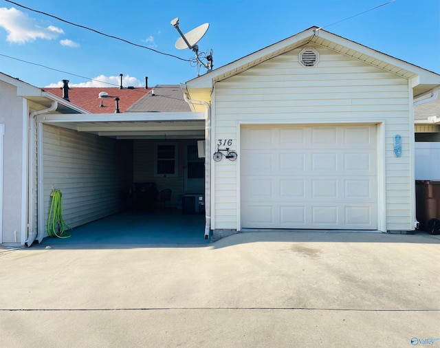 garage with central air condition unit and a carport