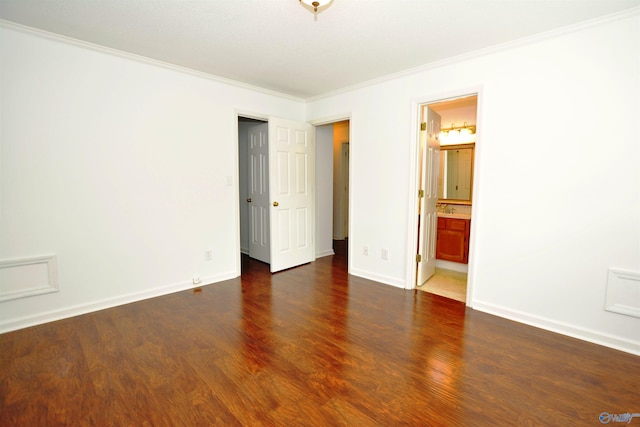 310 Drury Ln, Huntsville, AL 35802 - unfurnished bedroom featuring dark wood-style floors, ornamental molding, and ensuite bathroom