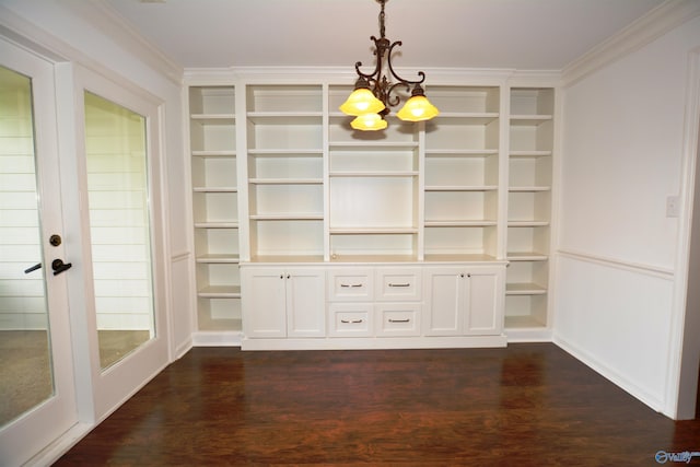 310 Drury Ln, Huntsville, AL 35802 - unfurnished dining area with a chandelier, dark wood finished floors, crown molding, and built in shelves