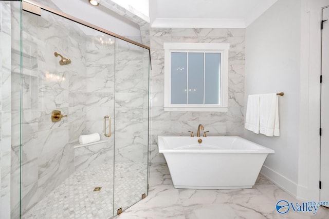 full bathroom featuring ornamental molding, marble finish floor, a freestanding bath, and a marble finish shower