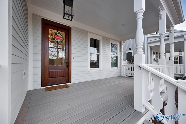 wooden deck featuring covered porch