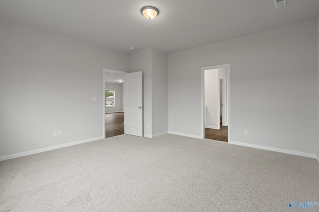 unfurnished bedroom with dark colored carpet