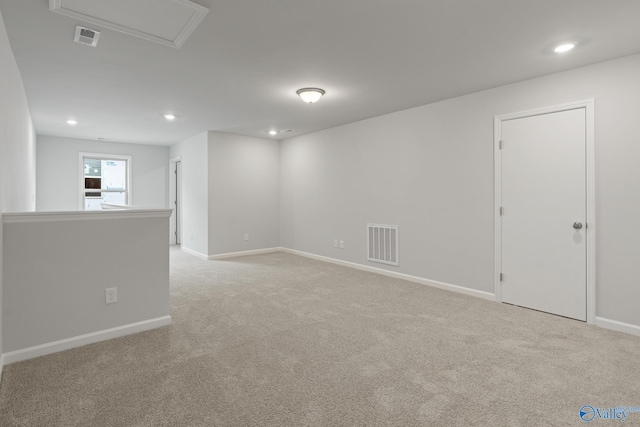 spare room with light colored carpet