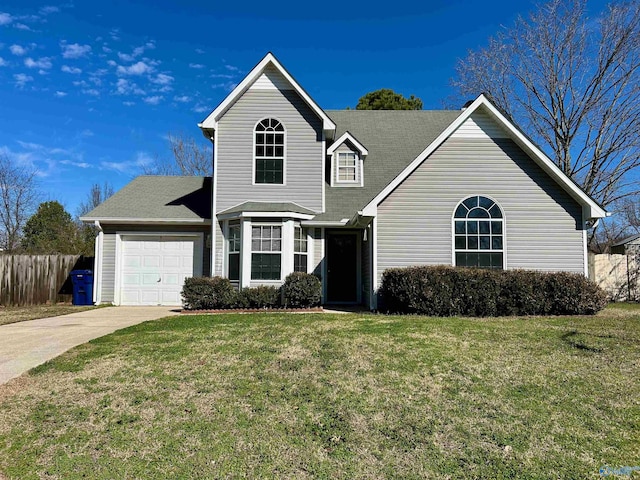 front facade with a garage and a front lawn