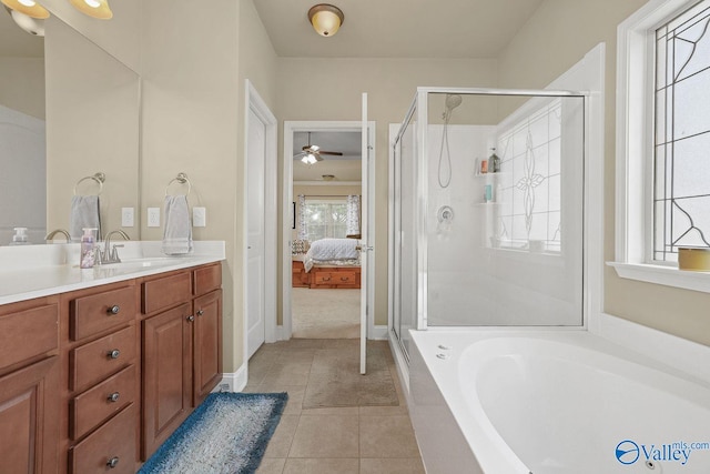 bathroom with vanity, tile patterned floors, plus walk in shower, and ceiling fan