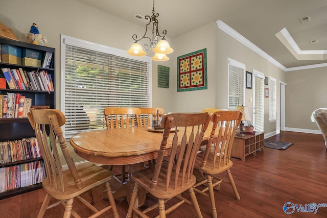 dining space featuring an inviting chandelier, ornamental molding, and dark hardwood / wood-style flooring