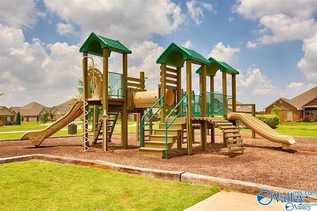 view of playground with a lawn