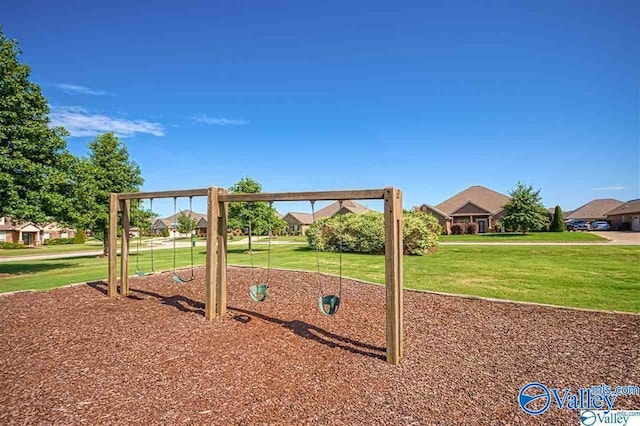 view of playground with a lawn