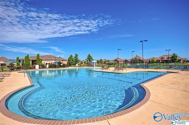 view of swimming pool featuring a patio area