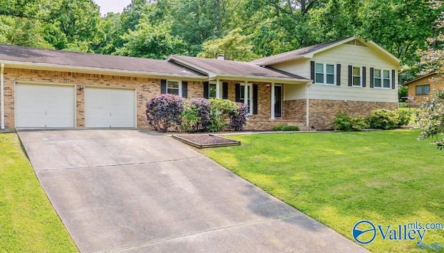 218 Beaver Run Dr, Madison, AL 35758 - tri-level home with brick siding, an attached garage, and a front yard