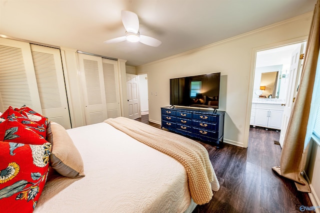 218 Beaver Run Dr, Madison, AL 35758 - bedroom with dark wood-style flooring, multiple closets, crown molding, baseboards, and a ceiling fan