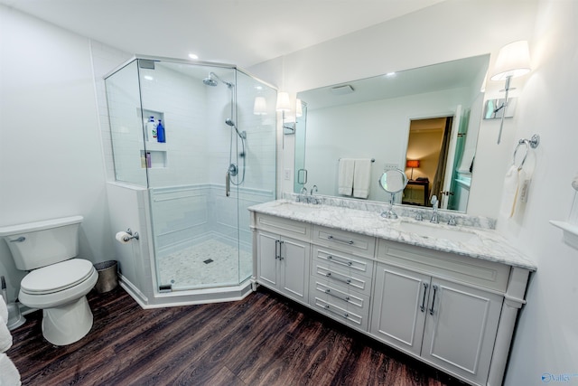 218 Beaver Run Dr, Madison, AL 35758 - bathroom featuring double vanity, wood finished floors, toilet, and a stall shower