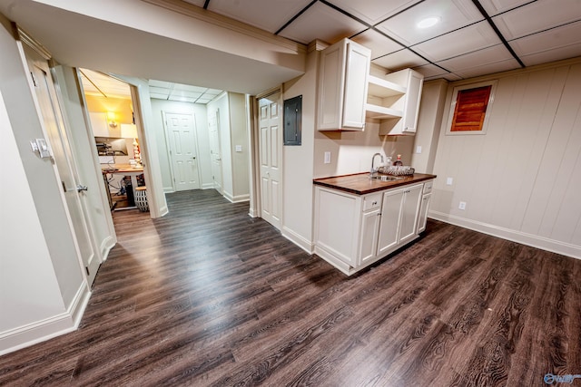218 Beaver Run Dr, Madison, AL 35758 - kitchen with butcher block countertops, a sink, open shelves, dark wood-type flooring, and baseboards