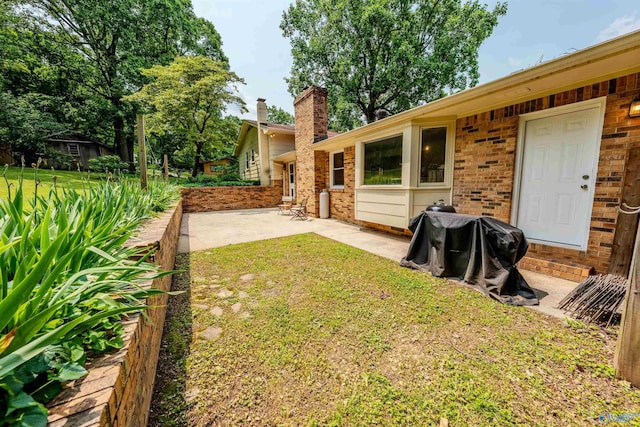 218 Beaver Run Dr, Madison, AL 35758 - view of green lawn with a patio