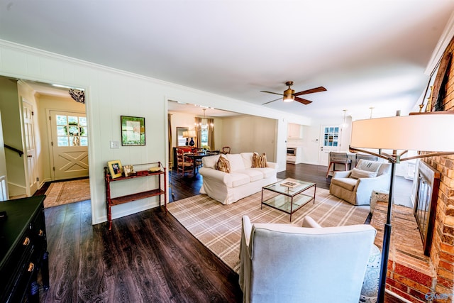218 Beaver Run Dr, Madison, AL 35758 - living room with wood finished floors, ornamental molding, a ceiling fan, and a chandelier