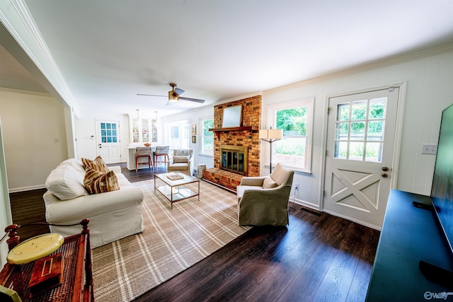 218 Beaver Run Dr, Madison, AL 35758 - living area with wood-type flooring, crown molding, a ceiling fan, and a fireplace