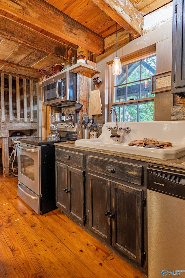 kitchen with beam ceiling, dark brown cabinets, wood ceiling, light wood finished floors, and appliances with stainless steel finishes