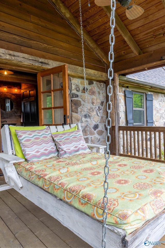 bedroom with vaulted ceiling with beams, wood ceiling, and hardwood / wood-style flooring