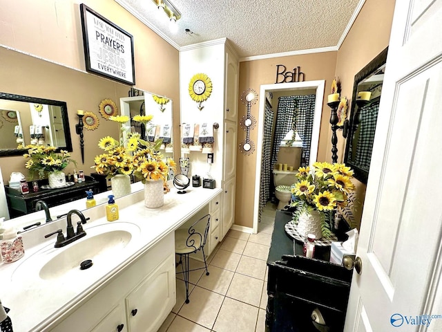 bathroom featuring ornamental molding, a textured ceiling, tile patterned flooring, and vanity