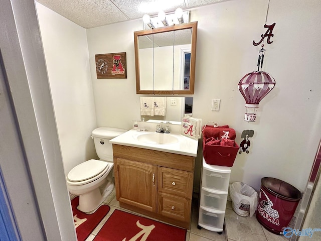 bathroom with tile patterned floors, vanity, and toilet