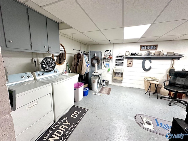laundry area with heating unit, cabinet space, and washing machine and dryer