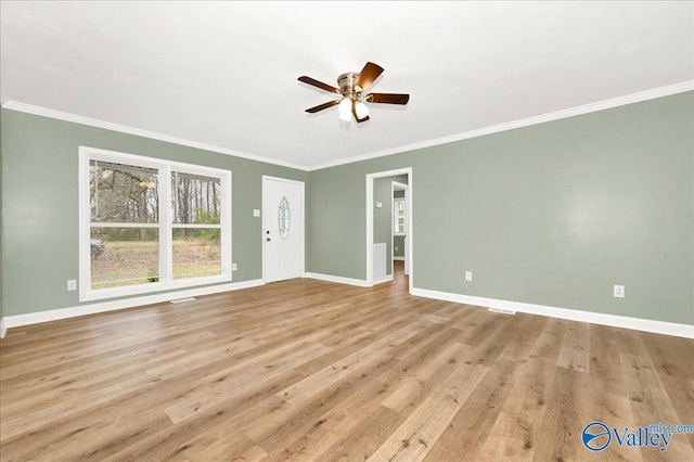 unfurnished living room featuring ceiling fan, crown molding, and light hardwood / wood-style flooring