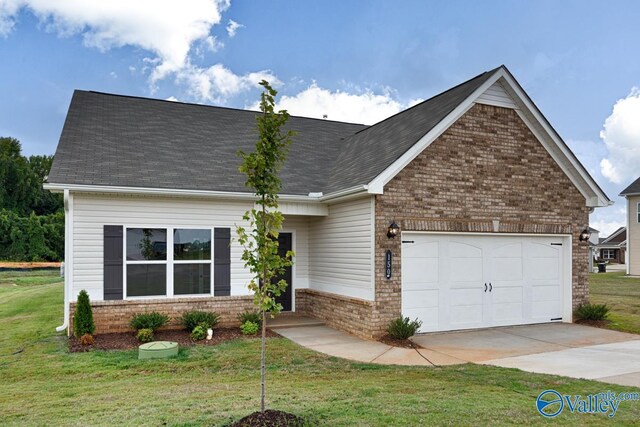 view of front of house with a garage and a front lawn