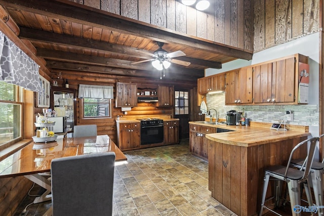 kitchen with sink, wood ceiling, backsplash, oven, and beamed ceiling