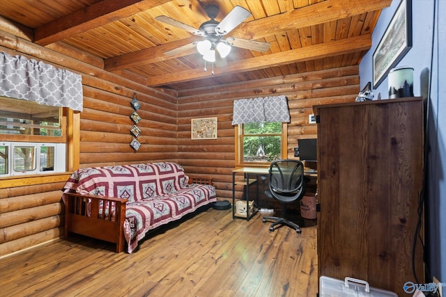 bedroom with wood ceiling, rustic walls, hardwood / wood-style floors, and beamed ceiling