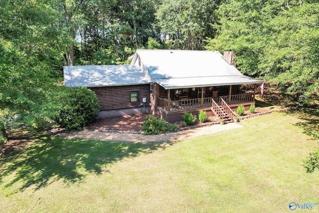 view of front of property with covered porch and a front yard