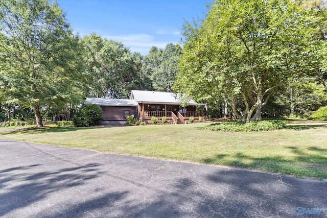 view of front of house with a front lawn and a porch