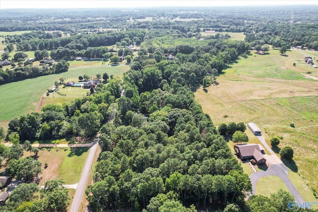 birds eye view of property with a rural view