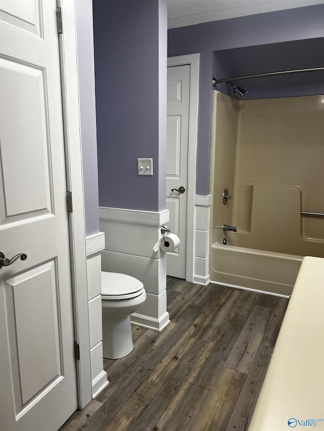 1727 SW Chestnut Mountain Rd, Decatur, AL 35603 - bathroom featuring wood finished floors, toilet, and washtub / shower combination