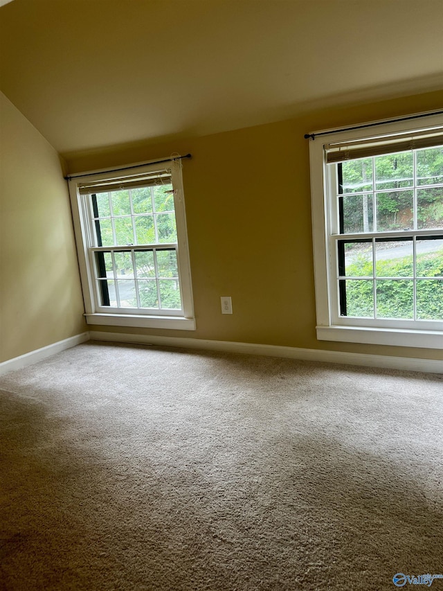 1727 SW Chestnut Mountain Rd, Decatur, AL 35603 - carpeted empty room featuring baseboards and vaulted ceiling
