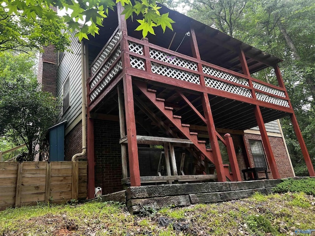 1727 SW Chestnut Mountain Rd, Decatur, AL 35603 - rear view of property with brick siding, a deck, and a chimney