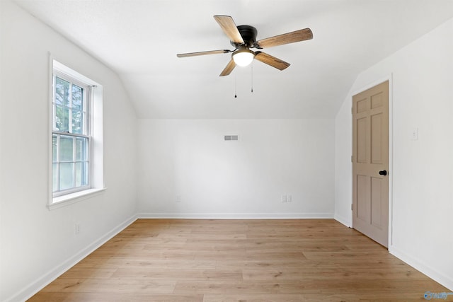 bonus room with vaulted ceiling, light hardwood / wood-style floors, and ceiling fan