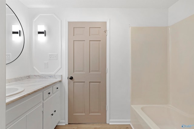 bathroom featuring vanity and hardwood / wood-style floors