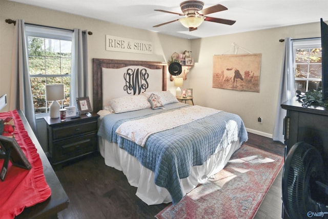 bedroom with ceiling fan and dark hardwood / wood-style flooring