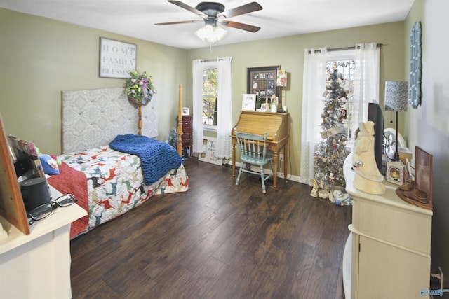 bedroom featuring dark hardwood / wood-style flooring and ceiling fan