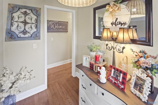 hallway with dark hardwood / wood-style floors