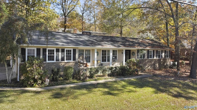 ranch-style home featuring a front yard