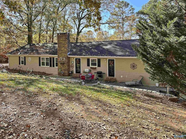 rear view of property with a patio