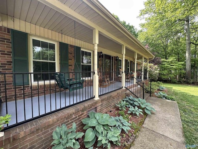 2008 Oakleaf Ln, Arab, AL 35016 - exterior space featuring a porch, brick siding, and a lawn