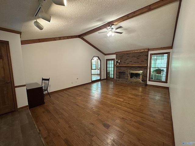 2008 Oakleaf Ln, Arab, AL 35016 - unfurnished living room with wood-type flooring, a textured ceiling, ceiling fan, and baseboards