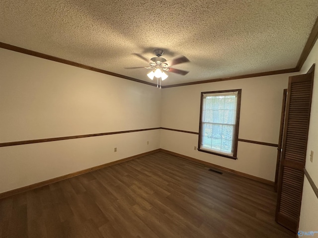 2008 Oakleaf Ln, Arab, AL 35016 - spare room with visible vents, ornamental molding, and dark wood-type flooring