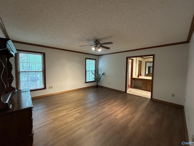 2008 Oakleaf Ln, Arab, AL 35016 - interior space with crown molding, ceiling fan, a textured ceiling, baseboards, and wood finished floors
